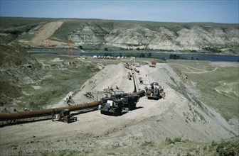 CANADA, Saskatchewan, Prairies, Constructing Trans Canada gas pipeline over Saskatchewan Prairies.