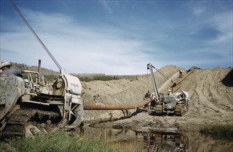 CANADA, Saskatchewan , Prairies, Constructing Trans Canada gas pipeline over Saskatchewan Prairies.
