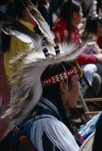CANADA, Alberta, Edmonton, Blackfoot Native American Indian child wearing tribal dress with other