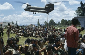 VIETNAM, Central Highlands, Kontum, Vietnam War. Montagnard refugees await shipment back to their