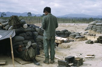 VIETNAM, Central Highlands, Kontum, "Vietnam War. Siege of Kontum. Montagnard soldiers in camp