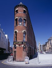 IRELAND, North, Belfast, "Bittles Bar, brick exterior facade, A-board advertising menu and beer