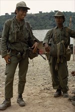 LAOS, Xianghoang, War, "Meo soldiers carrying guns and grenades, members of the CIA army under Gen.
