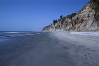 BANGLADESH, Chittagong, Cox’s Bazar, Empty beach and eroded cliff.