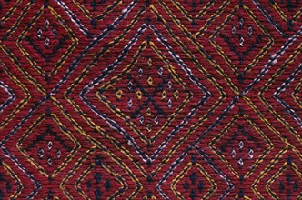 BANGLADESH, Crafts, Textiles, Detail of red and blue embroidered murang pinon or loin cloth.