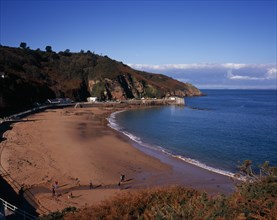 UNITED KINGDOM, Channel Islands, Jersey, St Mary’s. West view across beach at Vill of Greve de Lecq