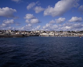 UNITED KINGDOM, Channel Islands, Guernsey, St Peter Port viewed from Castle Cornet harbour wall