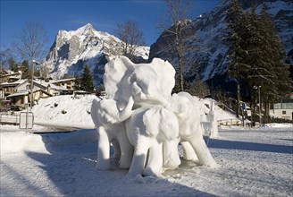 SWITZERLAND, Bernese Oberland, Grindelwald, World Snow Festival Ice Sculpture depicting elephants.