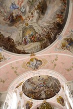 GERMANY, Bavaria, Oberammergau, The Town Church. Interior with frescos on ceiling and main altar.