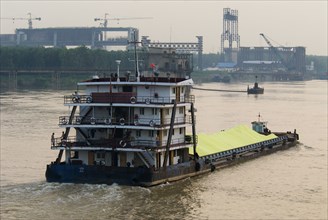 CHINA, Hubei, Yangtze, Barge carrying sulphur on the Yangtze River east of Wuhan