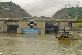 CHINA, Hubei , Sandouping, Sand barge approaching the westbound 5 step locks at the Three Gorges