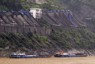 CHINA, Hubei , Sandouping, Industrial complex in the Wu Gorge. Line of trucks bring coal from the