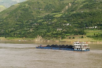CHINA, Chongqing, Wushan , Coal barge on the Yangtze River near Wushan