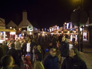 ENGLAND, West Sussex, Shoreham-by-Sea, Christmas shoppers at market in Bridge street.