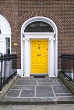 20093563 IRELAND Dublin Dublin Georgian doorway near Merrion Square with yellow door