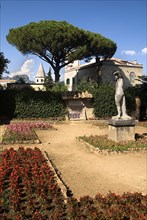 20093652 ITALY Campania Ravello Villa Cimbrone. Statue in walled gardens with Villa Cimbrone behind