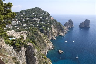 20093665 ITALY Campania Island of Capri Faraglioni Rocks from Punta del Cannone with Augustus Gardens and Carthusian Monastery