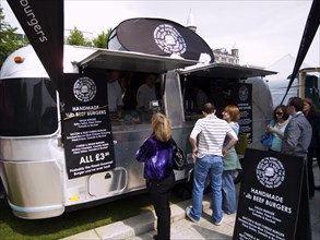 IRELAND, North, Belfast, Airstream trailer used as fast food outlet at food fair in the grounds of