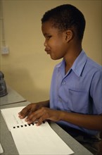 CARIBBEAN, Grenada, St Vincent, Boy learning Braille at St Pauls School for the blind