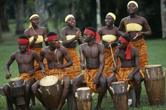 GHANA, Accra, Tribal drummers dressed in Kente cloth. Near Accra.