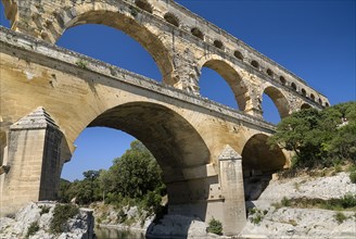FRANCE, Provence Cote d’Azur, Gard, Pont du Gard Roman aqueduct.  Angled view of the east side in