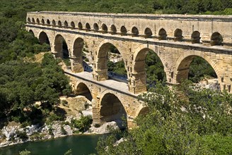 FRANCE, Provence Cote d’Azur, Gard, Pont du Gard Roman aqueduct from a high vantage point on the