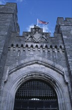 ENGLAND, West Sussex, Arundel, Arundel Castle. Part view of the entrance gate and crenelated towers