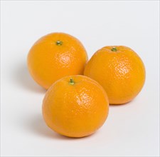 FOOD, Fruit, Citrus, Three oranges on a white background