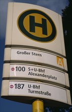 GERMANY, Berlin, Bus and tram stop sign  green H within yellow circle stands for Haltestelle or