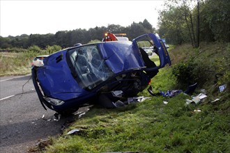 TRANSPORT, Road, Cars, Scene of a road accident invoving a blue Peugeot car.