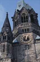 GERMANY, Berlin, Kaiser Wilhelm Memorial Church. Part view of ruined gothic exterior with clock