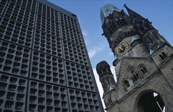 GERMANY, Berlin, Kaiser Wilhelm Memorial Church.  Part view of ruined gothic exterior with clock