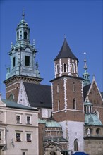 POLAND, Krakow, Detail of Wawel Cathedral exterior with clock tower above second tower and series