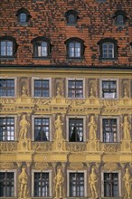 POLAND, Wroclaw, Detail of building facade with tromp l oeil painted mural creating effect of