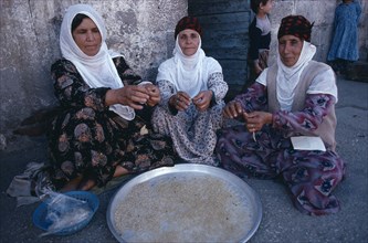 TURKEY, Diyarbakir, Kurdish women handmaking noodles.