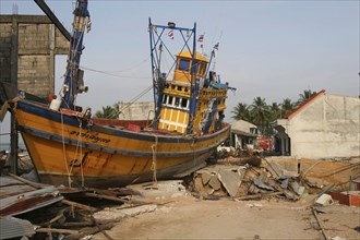 THAILAND, Phang Nga District, Nam Khem, "Tsunami. Boats have been pushed onto the streets which