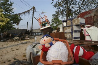 THAILAND, Phang Nga District, Nam Khem, "Tsunami. Childrens toys ly piled up and Boats have been