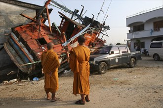 THAILAND, Phang Nga District, Nam Khem, "Tsunami. Monks looks at the damage caused by the tsunami,