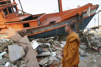 THAILAND, Phang Nga District, Nam Khem, "Tsunami. Monk looks at the damage caused by the tsunami,