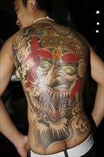 THAILAND, Phuket, Tattoo on mans back.