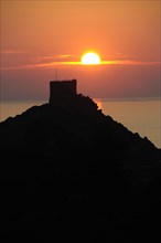 FRANCE, Corsica, Golfe De Porto, "Porto, Genoese tower against sunset"
