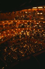 ENGLAND, East Sussex, Glyndebourne, Interior of auditorium with attendees taking their seats before