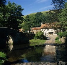 ENGLAND, Devon, Exmoor, Malmsmead on Badgworthy Water. Arched stone bridge and ford across river