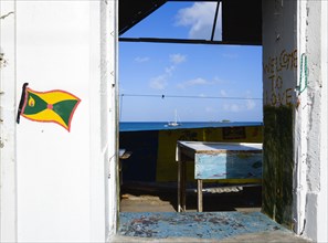 WEST INDIES, Grenada, Carriacou, Hillsborough Derelict building in the main street with the