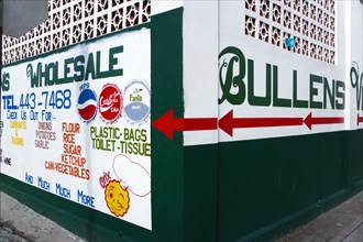 WEST INDIES, Grenada, Carriacou, Hillsborough The freshly painted walls of Bullens Wholesale shop