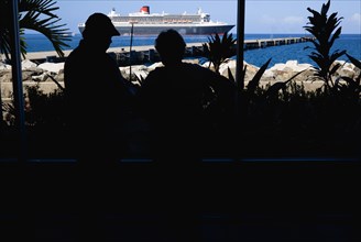 WEST INDIES, Grenada, St Georges, Tourists in the Cruise Ship Terminal looking out through the