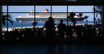 WEST INDIES, Grenada, St Georges, Tourists in the Cruise Ship Terminal looking out through the