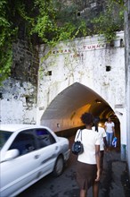 WEST INDIES, Grenada, St Georges, The Sendall Tunnel built in 1894 with pedestrians and cars moving