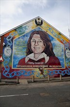 IRELAND, North, Belfast, "Falls Road, Mural of Bobby Sands on the gable end of the Sinn Fein