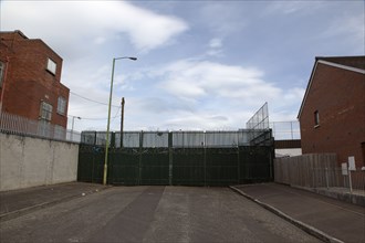 IRELAND, North, Belfast, "West, Falls Road, Peace Line barrier between the Catholic Lower Falls and